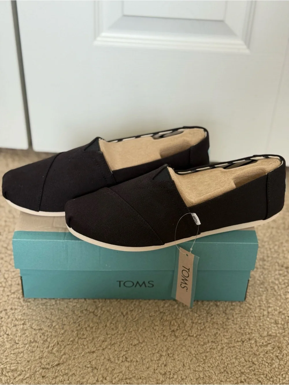 TOMS Black Canvas women’s Slip-On Loafers